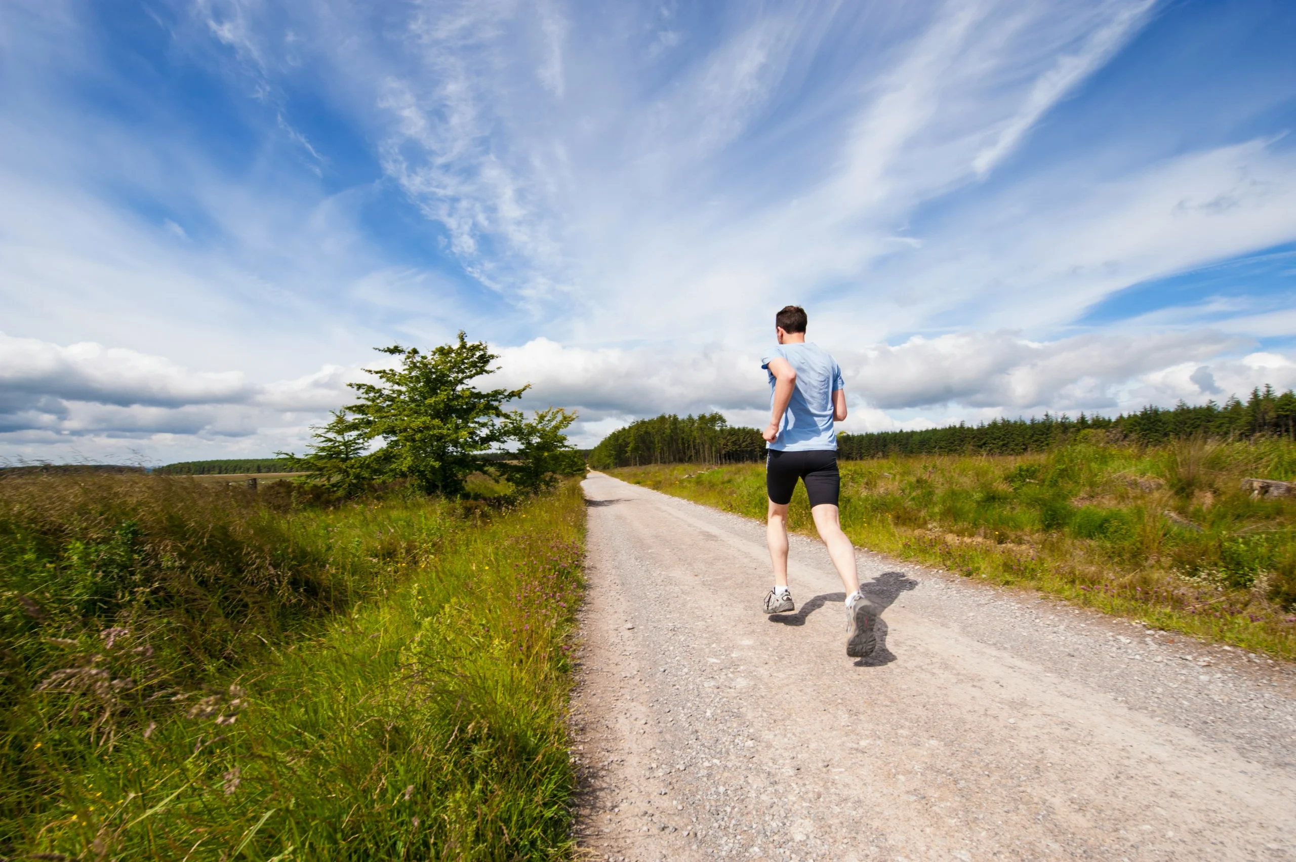 men run in road