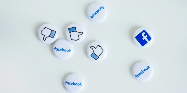 Facebook icon button in circle.
